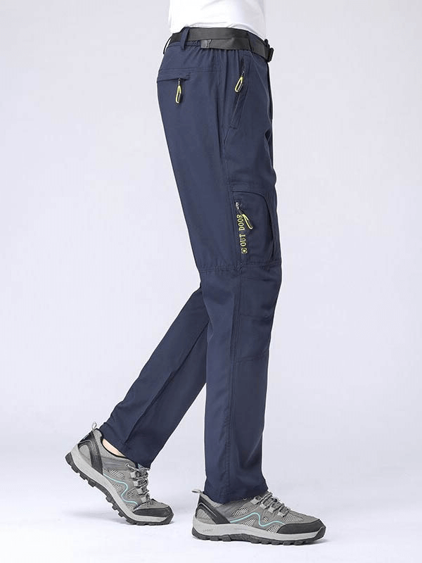 Men's waterproof tactical trousers SF0457 with multi-pockets, ideal for outdoor sports. Stretch material, flat front, elastic waist.